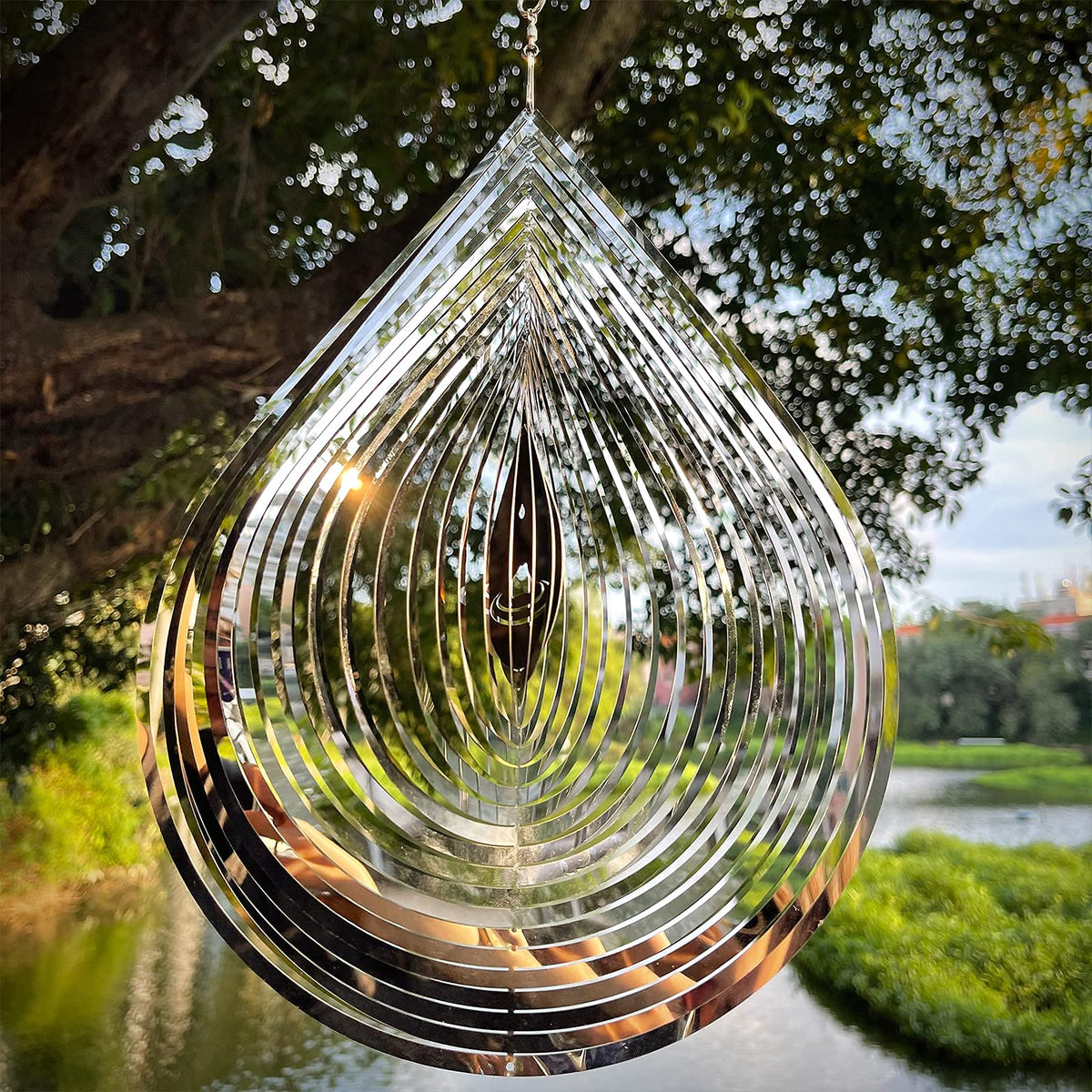Kexsscai reflective metal wind spinner adds dynamic color as it spins.