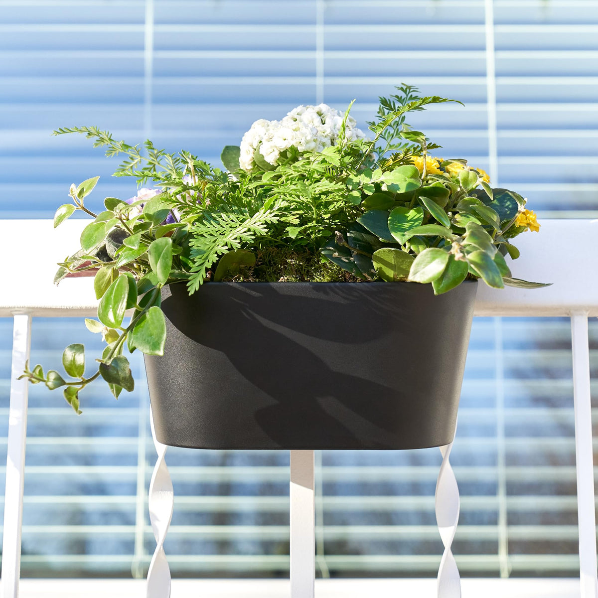 Close-up of drainage holes in KIBAGA planters supports balanced moisture for herbs.