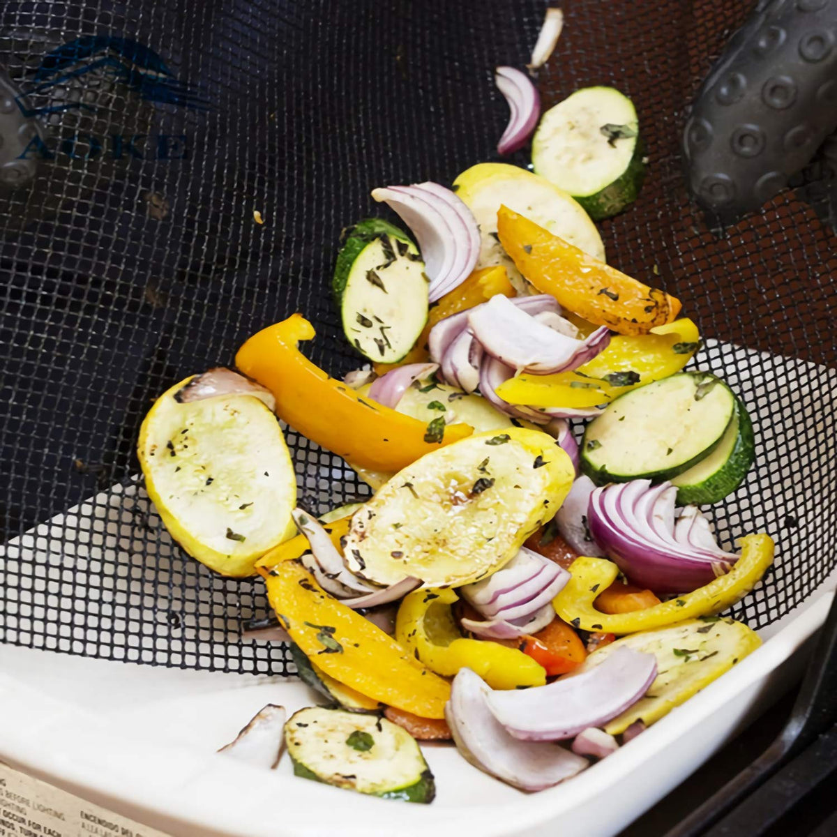 Kingrol mesh mat on a pellet grill showing versatile compatibility
