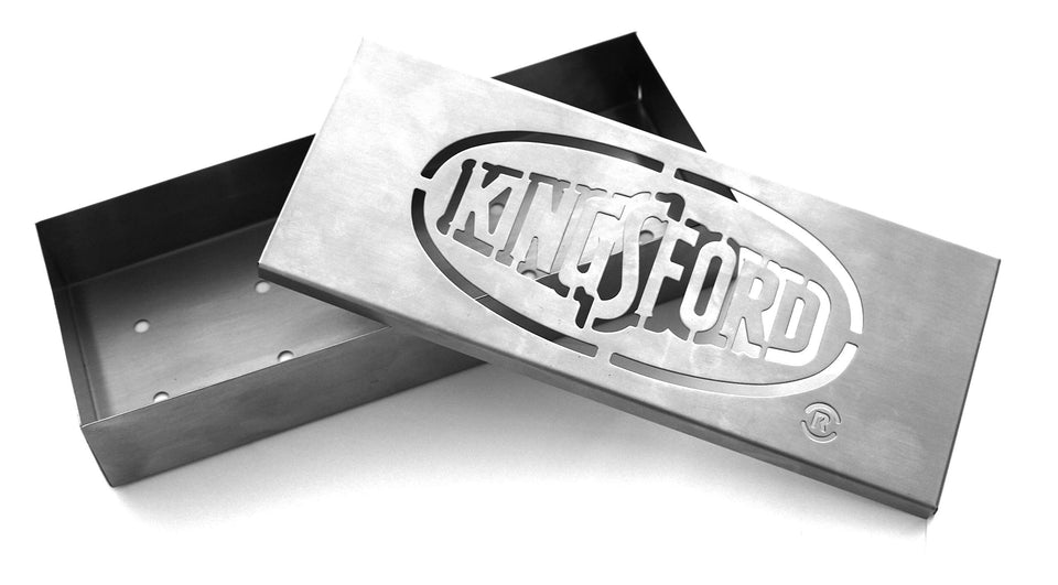 Kingsford smoker box over heat source adding wood chip flavor to grilled foods.