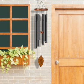 Kingtto Outdoors wind chimes hanging from tree as outdoor memorial decor.