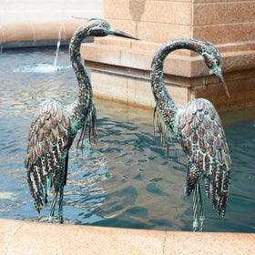 Kircust crane statue textured metal finish offers durable outdoor decor.