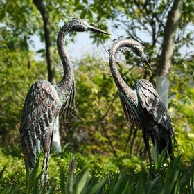 Kircust crane preening statue in layered metal evokes natural grace in your yard.