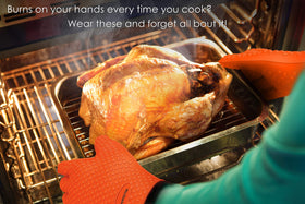 Kitchen Perfection glove pair captured with non-slip grip while handling hot meat on a smoker