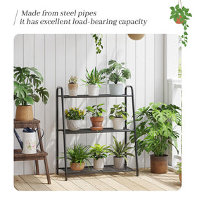Kitsanery heavy-duty metal plant shelf supports large pots.