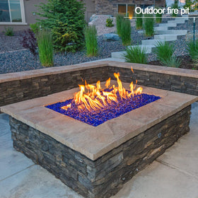 Kleuete Pacific Blue night glow from fire glass creates cozy backyard lighting.
