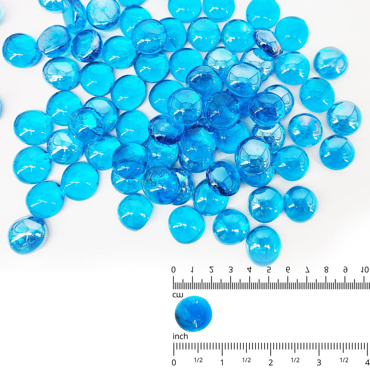 Kleuete Pacific Blue fire glass drops half-inch close-up show reflective facets for glow.