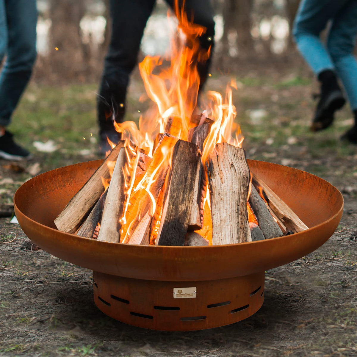 KOL Fire Pit oxidized finish complements rustic patio décor.