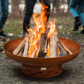 KOL Fire Pit oxidized finish complements rustic patio décor.