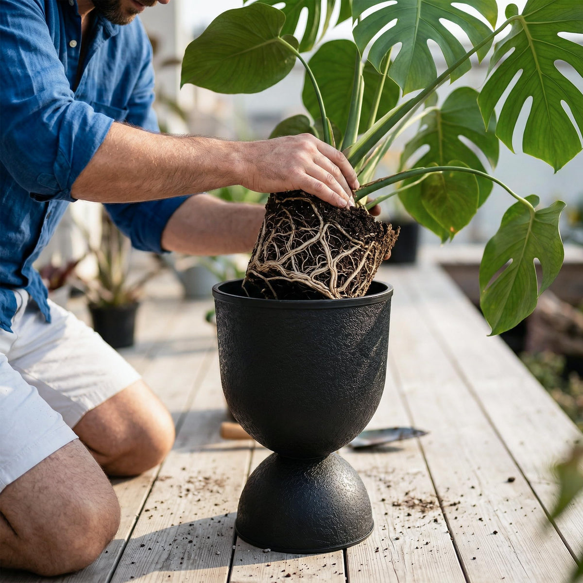 KOL Planters black finish closeup, showcasing durable, stylish urn silhouette.