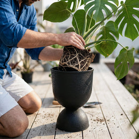 KOL Planters black finish closeup, showcasing durable, stylish urn silhouette.