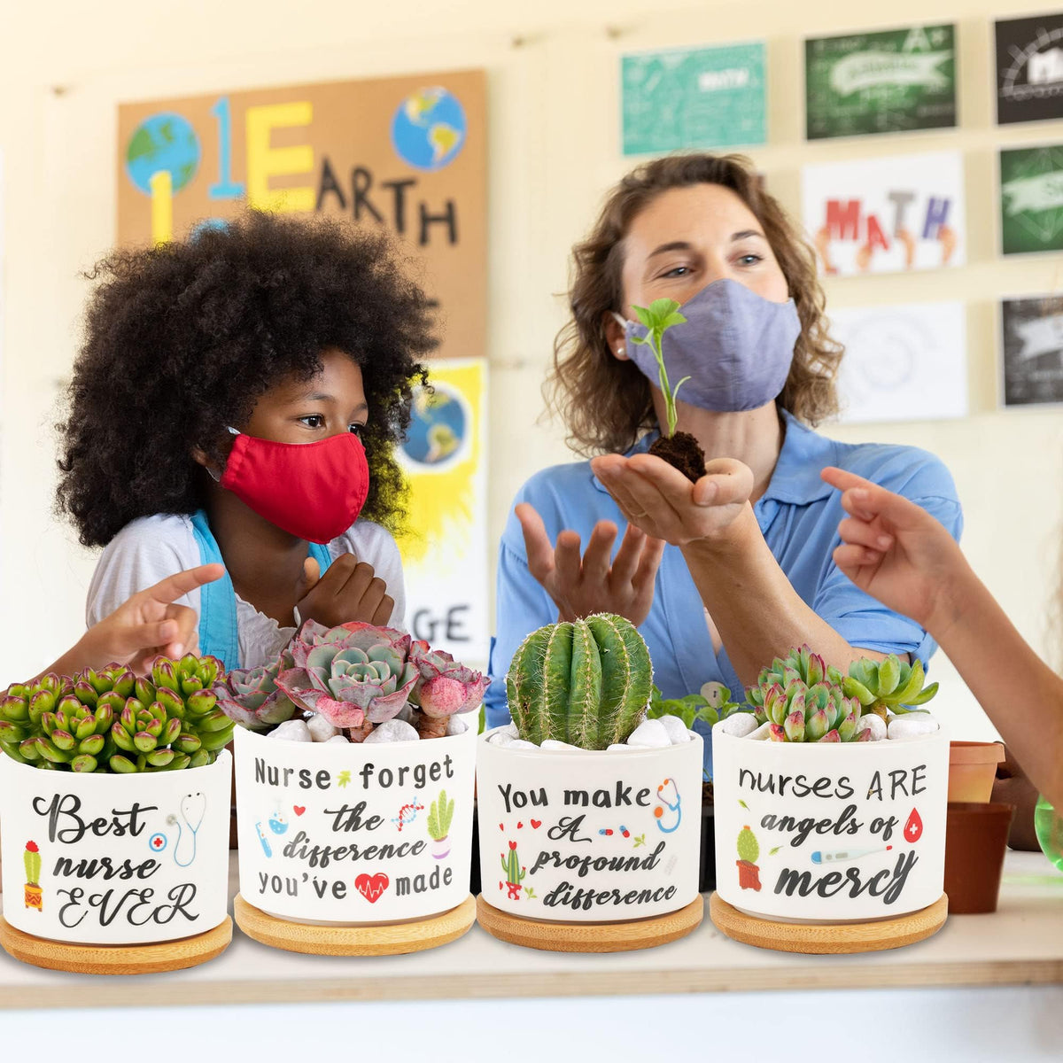 Kolewo4ever nursing appreciation pots on desk or windowsill.