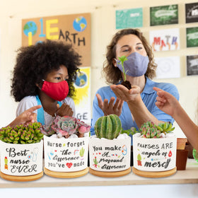 Kolewo4ever nursing appreciation pots on desk or windowsill.
