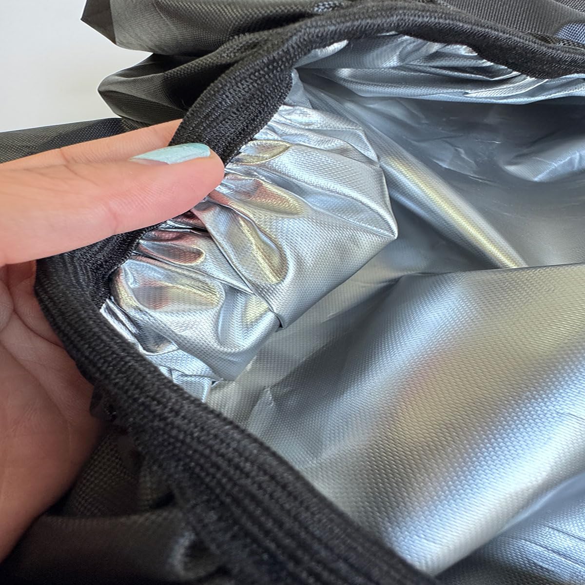 KUAINICE outdoor-use cover keeps hoses tidy and ready for next watering.