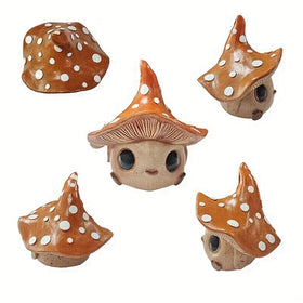 Kudriod mushroom garden statue in yard, perfect for fairy-tale vibes.