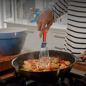 La Cuisine slotted design drains liquids while flipping meals
