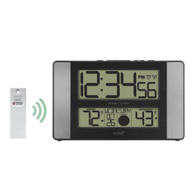 La Crosse 513-1417AL-INT display featuring calendar and moon phase icons.