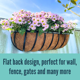 LáLáGreen herb-filled rail planter on sunny fence.