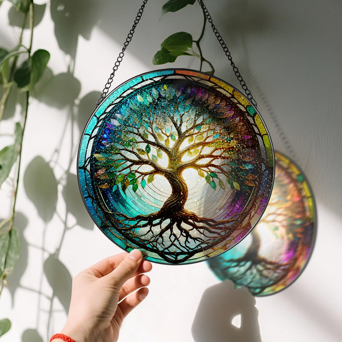 LAOWEIKI suncatcher in a black metal frame and chain, an elegant window decor option.