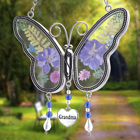 Laraine butterfly suncatcher glass wind chime adds color on spring mornings.