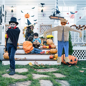 LarpGears pumpkin-head mask with scarecrow body creates dramatic garden focal point.