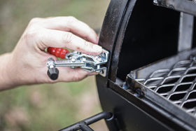 Adjustable LavaLock clamps designed for offset smokers to accommodate HL/LH configurations.