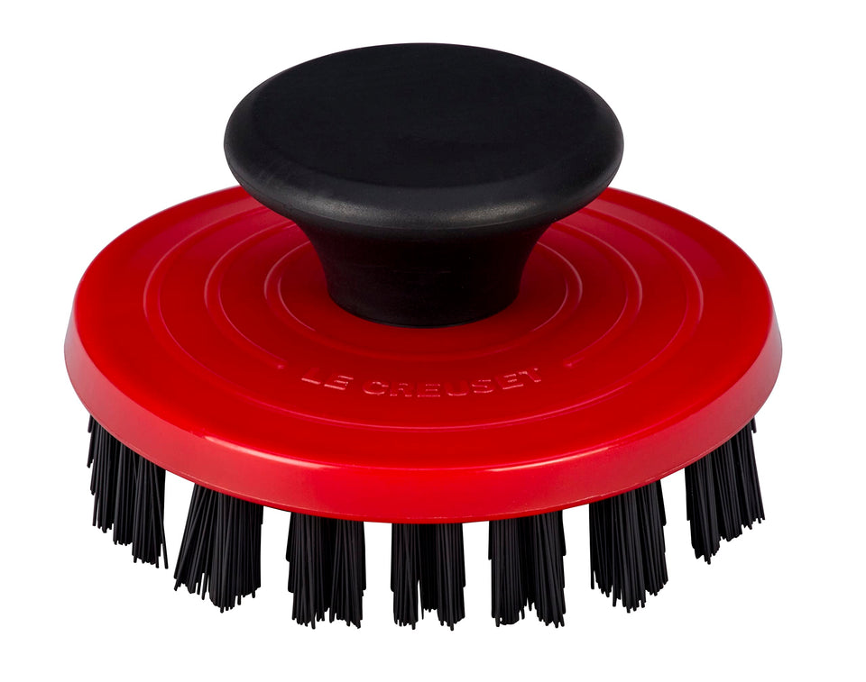 Le Creuset nylon brush 3-1/4in cerise cleans grill pan ridges effectively.