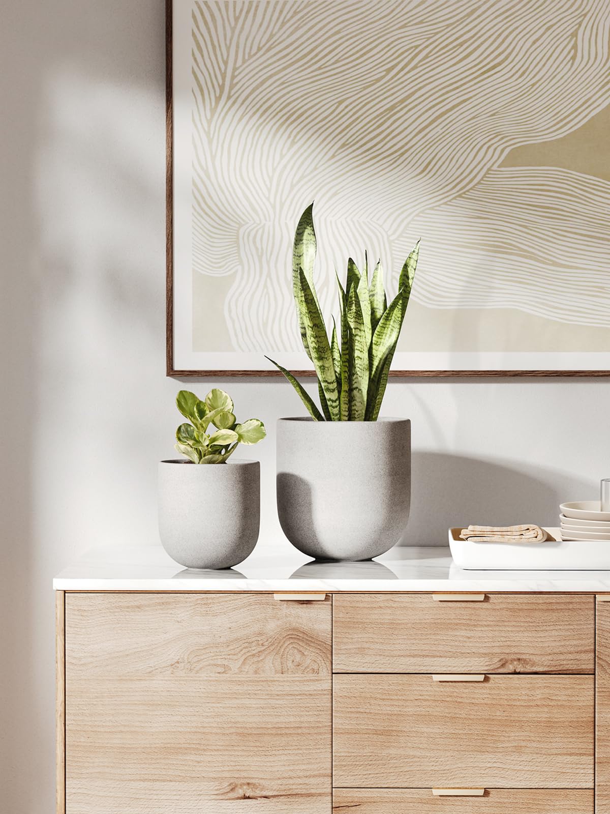 Close-up of LE TAUCI unglazed ceramic texture and cement-gray finish.