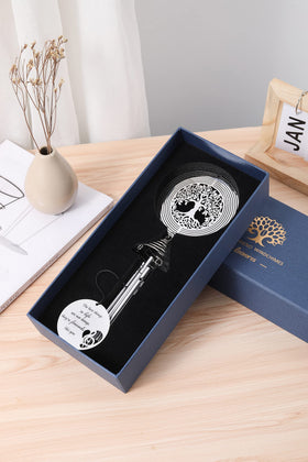 LEAVORES wind chime in a breezy garden setting with spinner dancing