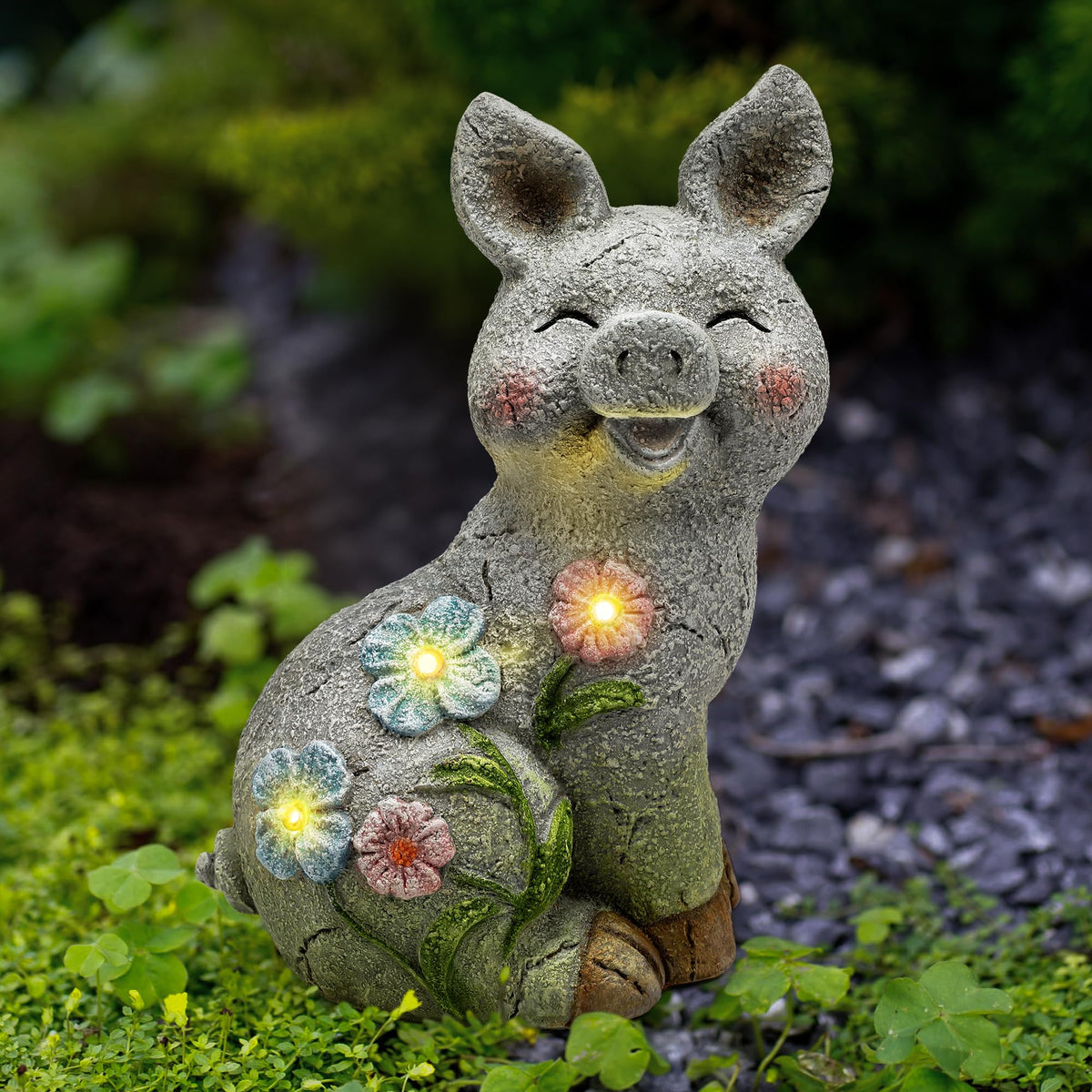Leekung solar pig statue outdoors; welcoming garden glow for guests.