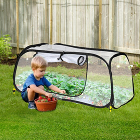 Lettry garden cover secured with four ground stakes to resist wind.