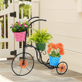 LEWIS&WAYNE tricycle planter with blue pails adds playful color to patios.
