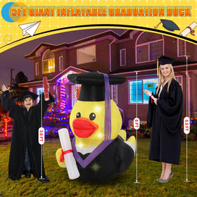 Leyndo inflatable duck with LED lights illuminated for evening graduation celebrations.