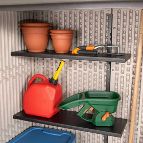 Lifetime Vertical Storage Shed Desert Sand interior shelves organizing small tools.
