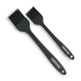 Lightyear silicone basting brush set in use for even glaze