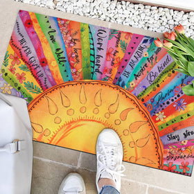 Close-up of the sun motif and colorful flowers in bold detail.