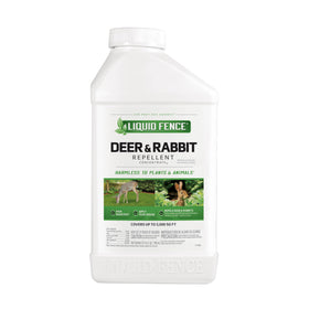 Liquid Fence Deer & Rabbit Repellent Concentrate bottle ready to apply, deterring pests.