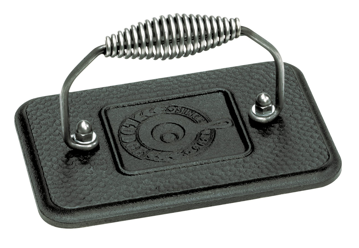 Lodge grill press with cool-grip handle for safe, even heating on stovetop or grill