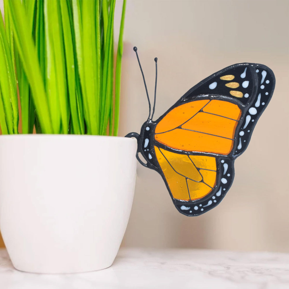 Lolitarcrafts monarch butterfly suncatcher brightens sunny windows with vibrant stained glass.