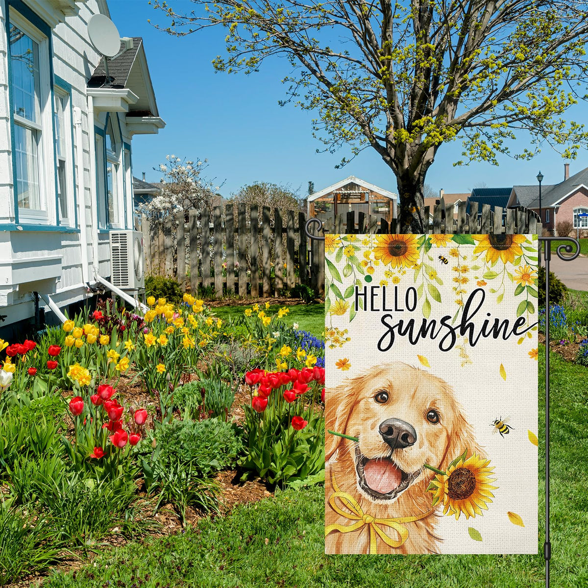 Louise Maelys garden flag shows golden retriever with sunflowers to create a welcoming outdoor vibe