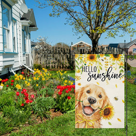 Louise Maelys garden flag shows golden retriever with sunflowers to create a welcoming outdoor vibe