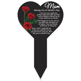 Lounsweer mom memorial plaque heart marker in garden, a touching outdoor remembrance.