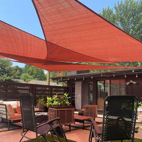 LOVE STORY triangle Terra Red shade sail close-up shows UV-resistant fabric for outdoor shade