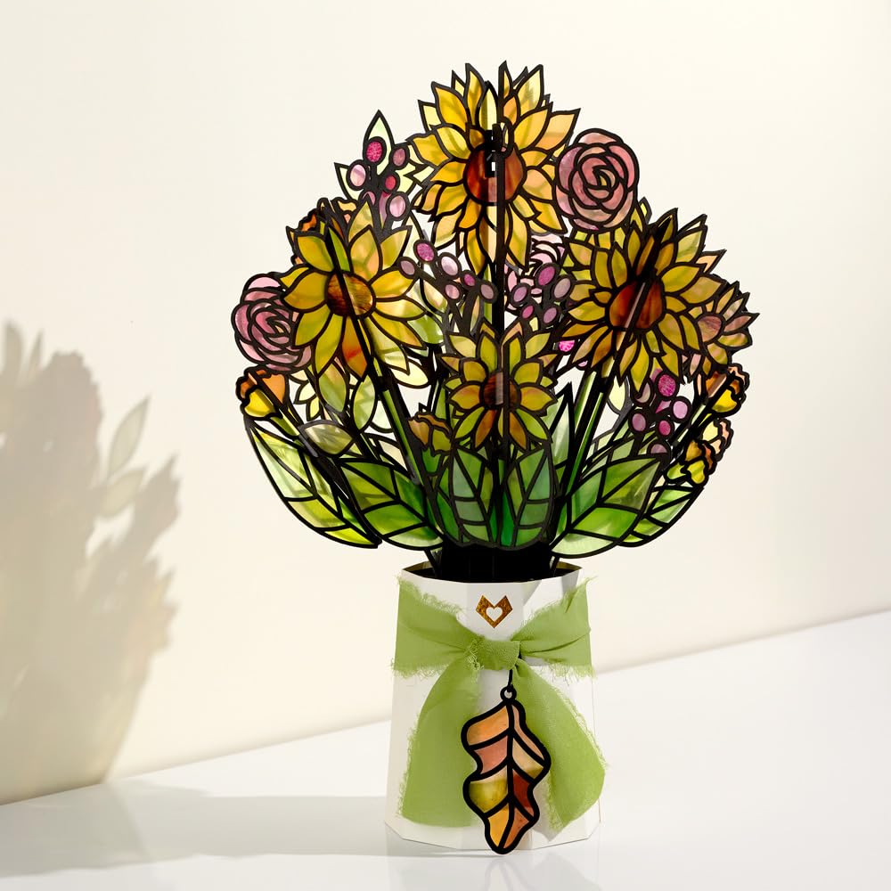 Lovepop golden-hour suncatcher features ribbon and oak leaf charm for a charming accent.