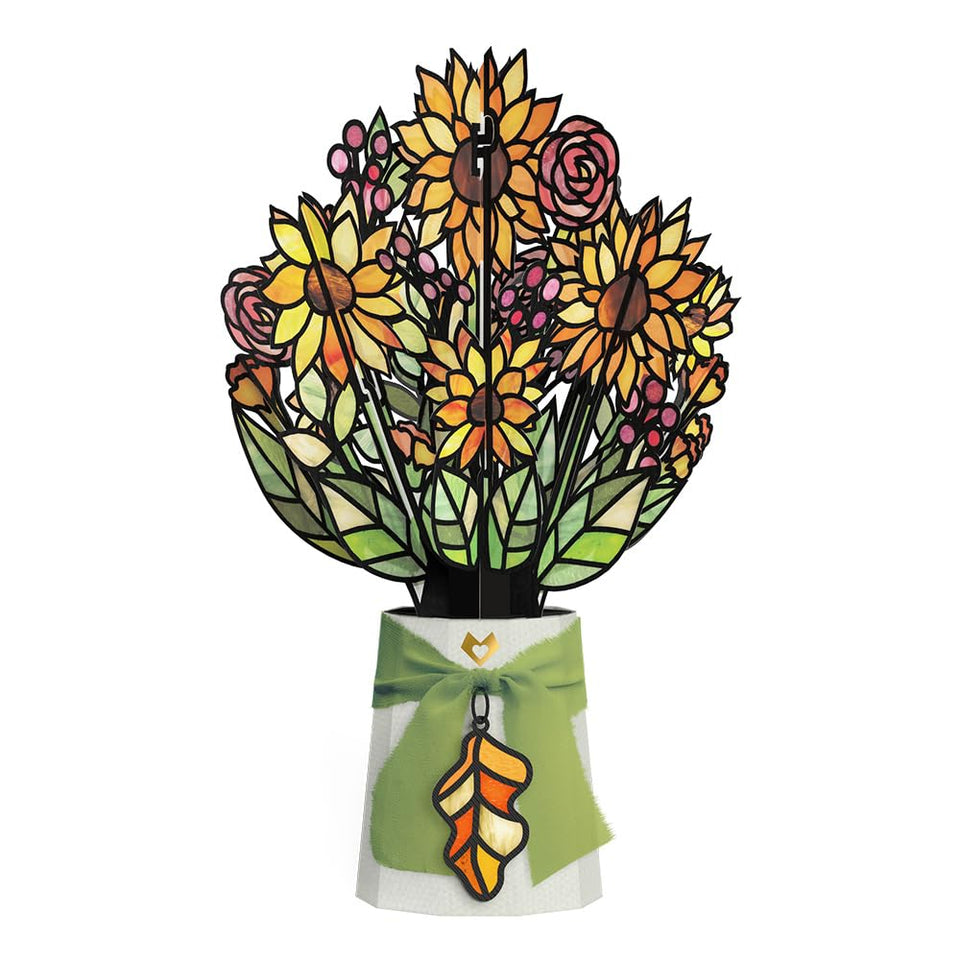Lovepop golden-hour sunflower suncatcher 12in glows beautifully in natural light on a windowsill.