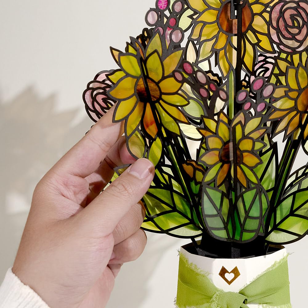 Lovepop laser-cut acetate sunflower petals create a rich, stained-glass glow.