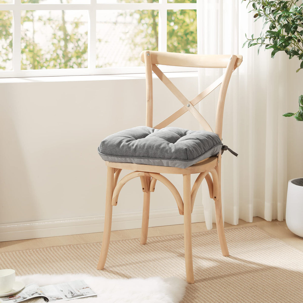 Love's cabin grey memory foam chair cushions on a modern kitchen chair.