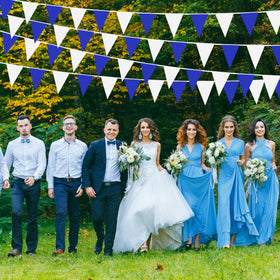 Indoor birthday party decoration with LoveVC pennant banner in blue and white.