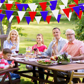 LoveVC pennant banner outdoor party idea with colorful flags along a fence