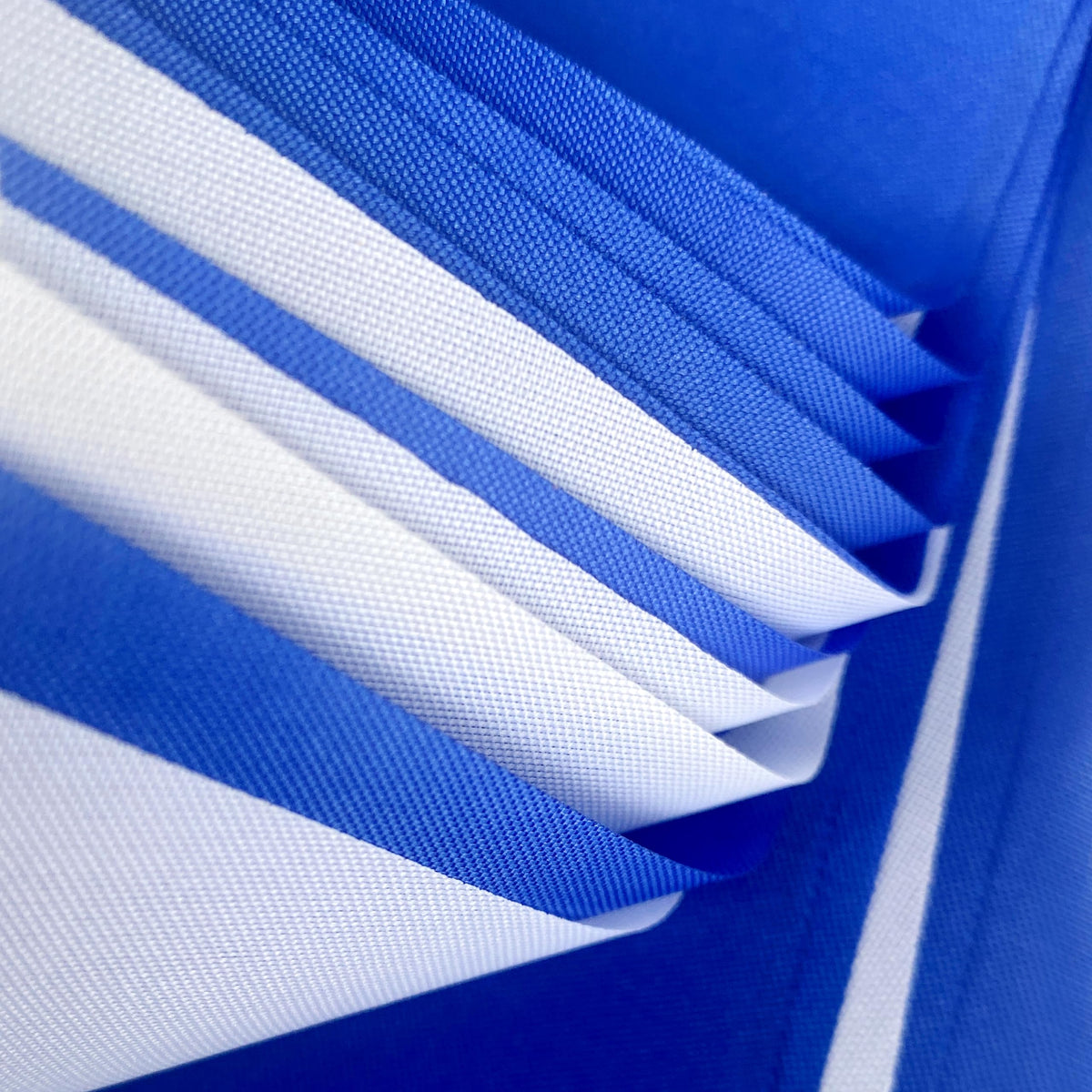 Outdoor wedding decor using LoveVC pennant banner in blue and white.